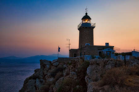 Lighthouse on the coast on sunset, Greece coastlineの写真素材