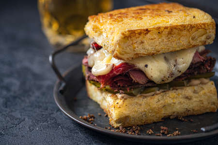 Ruben sandwich. New York sandwich with pastrami. Front view. Fast food.の写真素材