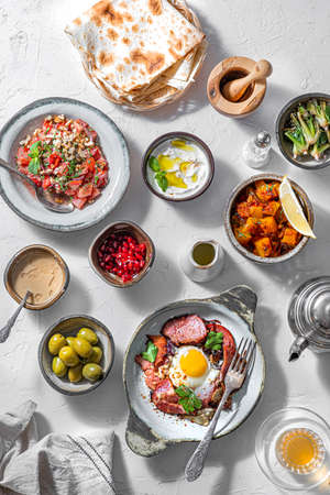 Healthy Turkish breakfast spread in the bright morning, white backgroundの写真素材