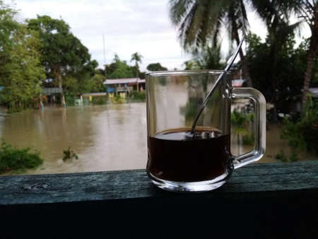 Drink coffee while floodの写真素材