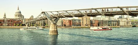 Panoramic picture of St Paul's Cathedral and Millennium Bridge at night.の写真素材