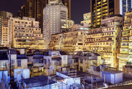 Apartment buildings at night in Hong Kong.の写真素材