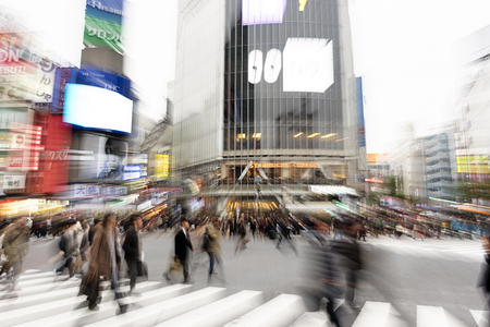 Tokyo, Japan - January 17, 2016: Evening rush hour at the famous Shibuya Crossing in Tokyo, Japan. This area is known as one of the fashion centers of Japan.のeditorial素材