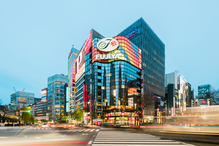 Tokyo, Japan - January 21, 2016: Evening rush hour near Fujiyma Building in the Ginza District in the Ch?? area of Tokyo, one of the most luxurious shopping districts in the world.のeditorial素材