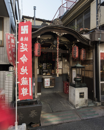 Tokyo, Japan - January 09, 2016:A  Small Shrine in the Streets of Yanaka, Tokyo. Yanaka  is one of the few districts in Tokyo where the shitamachi atmosphere, an old town ambience  of Tokyo still survives.のeditorial素材