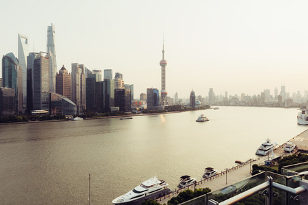 Shanghai, China - October 16, 2015:  Elevated view of  Pudong skyline in Shanghai- China. Pudong is a district of Shanghai, located east of the Huangpu River across from the historic city center of Shanghai in Puxi.のeditorial素材