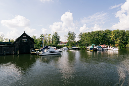Schwerin, Germany - Sept 10, 2017: Motorboats are parking at the front of a boat house in Schwerin, Germany.のeditorial素材