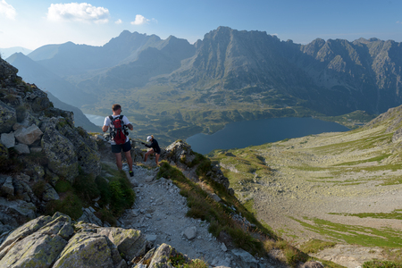 Zakopane, Poland - Aug 13, 2018: Hiker near  the Czarny Staw pod Rysami and Morskie Oko lakes in the High Tatra Mountains. Szpiglasowaのeditorial素材
