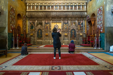 Cluj Napoca, Romania - 25 Oct, 2019: People pray in the  The Dormition of the Theotokos Cathedral, Cluj Napoca, Romania,のeditorial素材