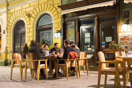 Brasov, Romania - Nov 10, 2019: Republicii street, the main pedestrian and shopping street in Brasov, full of restaurants. Brasov, Romaniaのeditorial素材