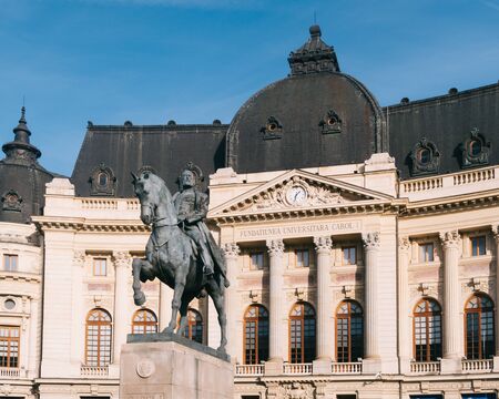 Bucharest, Romania - Dec 15, 2019: Central University Library of Bucharest, and King Carol I statue, Romaniaのeditorial素材