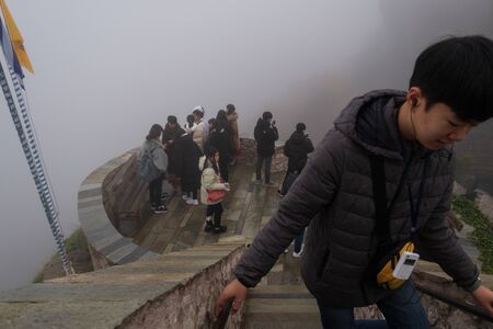 Meteora, Greece - Dec 19, 2019: Asian tourists at The Holy Monastery of Rousanou in Winter , Meteora, Kalabaka, Greeceのeditorial素材