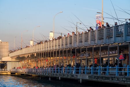 Istanbul, Turkey - Jan 10, 2020: Local fishermen on the Galata Bridge, Istanbul, Turkeyのeditorial素材