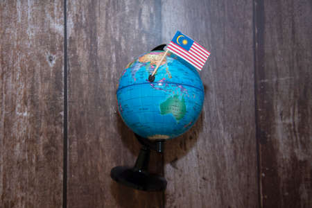 Malaysia mini flag on earth globe.の写真素材