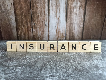 'Insurance' word on wood block concept.の写真素材