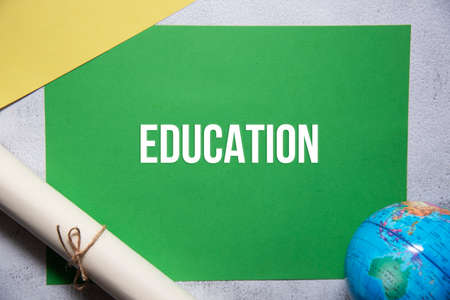 Education text on green and yellow background flat lay concept. Suitable to used as title cover each subtopic on resume or curriculum vitae.の写真素材