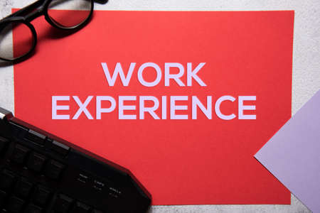 Work experience text on red and purple background flat lay concept. Suitable to used as title cover each subtopic on resume or curriculum vitae.の写真素材