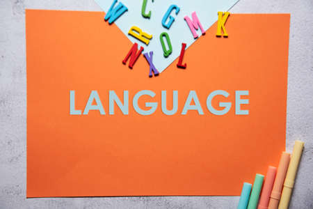 Language text on orange and baby blue background flat lay concept. Suitable to used as title cover each subtopic on resume or curriculum vitae.の写真素材
