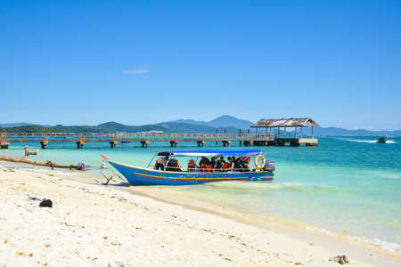 Langkawi Island, Kedah, Malaysia : 28th December 2020 - Landscape view of passengers boats at the beach.のeditorial素材