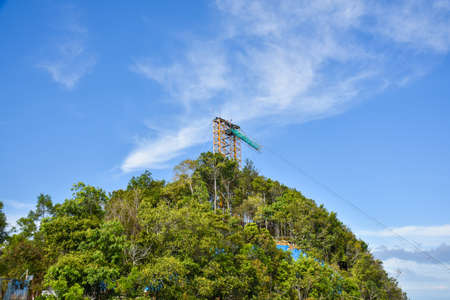 Langkawi, Kedah, Malaysia : 27th December 2020 - View of cable car tower in the mountain.のeditorial素材
