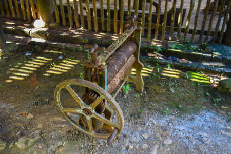 Kedah, Malaysia : 28th December 2020 - Old rubber sheet roller machine.