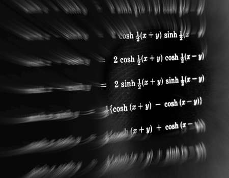 Large number of mathematical formulas focus zoom on a black background