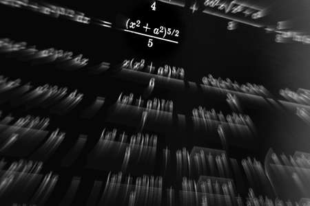 Large number of mathematical formulas focus zoom on a black backgroundの写真素材