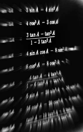 Large number of mathematical formulas focus zoom on a black backgroundの写真素材