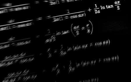 Large number of mathematical formulas focus zoom on a black background