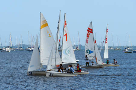 Miami, Florida 01-09-2015 Sailboats in a high school regatta in Biscayne Bay on a sunny winter day.
