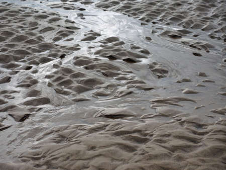 Patterns in sand at extreme low tide on Cannon Beach, Oregon.