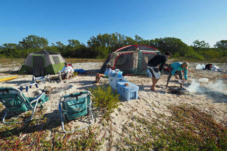 Everglades National Park, Florida 02-12-2017 Backcountry campers prepare breakfast on East Cape Sable on a clear winter day.のeditorial素材