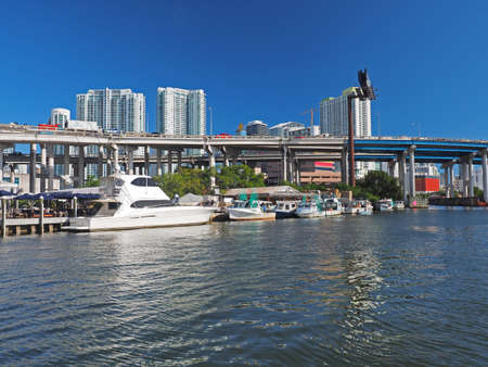 Miami, Florida 03-01-2019 The Miami River and surrounding residential and commercial buildings on a clear and sunny March afternoon.のeditorial素材