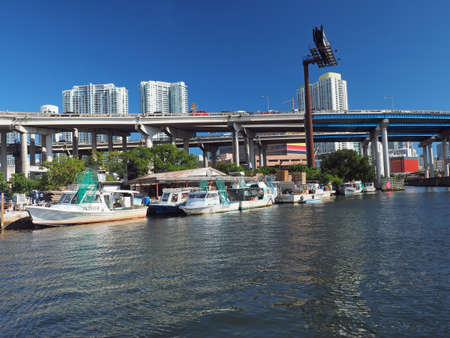 Miami, Florida 03-01-2019 Lobster boats docked on the Miami River on a clear and sunny March afternoon.のeditorial素材