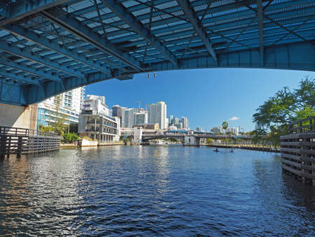 Miami, Florida 03-01-2019 The Miami River and surrounding residential and commercial buildings on a clear and sunny March afternoon.のeditorial素材