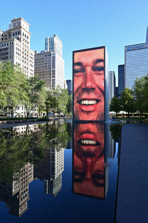 Chicago, Illinois 08-09-19 Crown Fountain video sculture by Jaume Plensa and reflection in Millennium Park on cloudless early summer morning.のeditorial素材