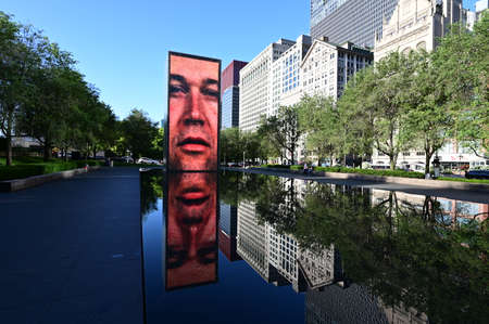 Chicago, Illinois 08-09-19 Crown Fountain video sculture by Jaume Plensa and reflection in...