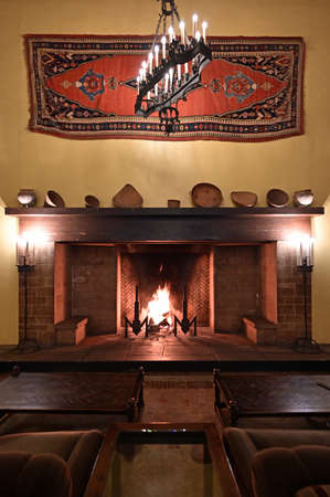 Yosemite National Park, California - January 20, 2020 - Fireplace in Ahwahnee Hotel provides warmth on cold winter night.のeditorial素材
