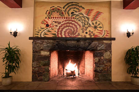 Yosemite National Park, California - January 20, 2020 - Fireplace in Ahwahnee Hotel provides warmth on cold winter night.のeditorial素材