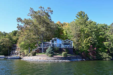 Lake Santeetlah, North Carolina - October, 2020 - Lake homes on lakeshore in autumn.のeditorial素材