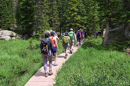Rocky Mountain National Park, Colorado - July 26, 2021 - Visitors hike on crowded Emerald Lake Trail...