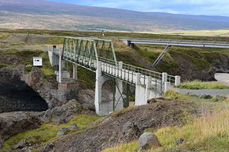 Bridges over Skjalfandafljot River downriver from Godafoss Falls in northern Iceland on sunny autumn afternoon.の写真素材