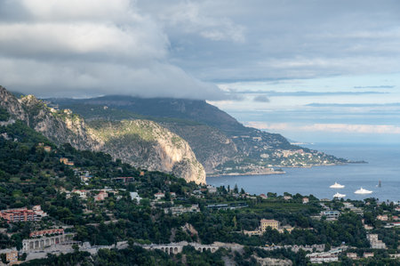 Yachts at anchor in natural harbor of Villefranche-sur-Mer on sunny summer afternoon.の写真素材