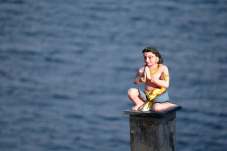 Hindu statue praying at Koneswaram temple in Trincomalee, Sri Lanka, an important hindu shrineの写真素材