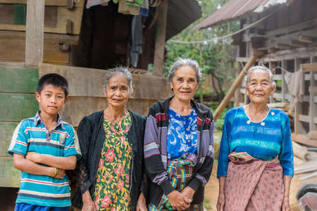 Taupe, Sulawesi, Indonesia - August 16, 2014: Portrait of Toraja senior and young people in the village of Taupe, Mamasa region, West Tana Toraja, Sulawesi, Indonesia.のeditorial素材