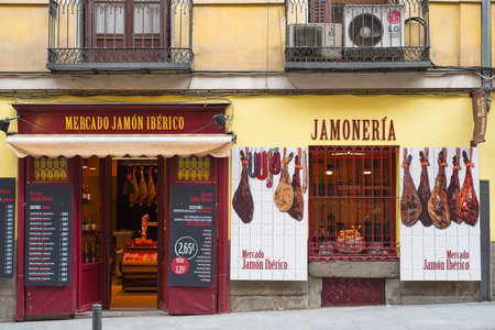 Madrid, Spain - September 13, 2015: Store selling spanish ham (transl. "Merdado Jamon Iberico" or "Jamoneria") in Madrid centre, Spain.のeditorial素材