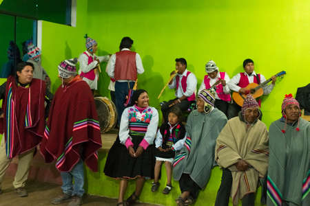 Amantani, Peru - August 31, 2015: tourist, musicians and local people performing traditional dance...