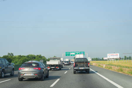 Turin, Italy - June 5, 2015: Traffic and queue in the morning rush hour on the highway A4 Milan to...