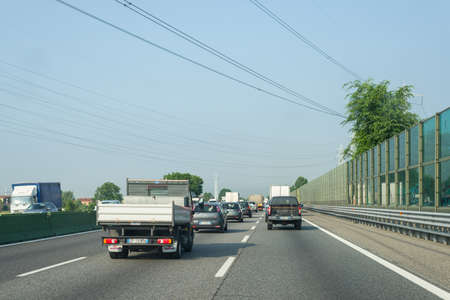 Turin, Italy - June 5, 2015: Traffic and queue in the morning rush hour on the highway A4 Milan to Turin, the most important business and industrial poles in Northern Italy.のeditorial素材
