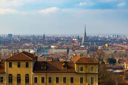 Turin cityscape, Torino, Italy at sunset, panorama with the Mole Antonelliana over the city. Scenic colorful light and dramatic sky.の写真素材